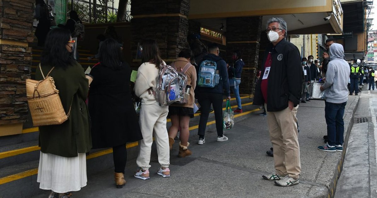 Bar examinees line up with clear bags at a Philippine Bar Examinations testing center